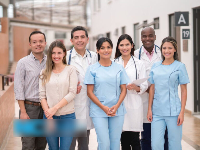 Group of healthcare professionals smiling together.