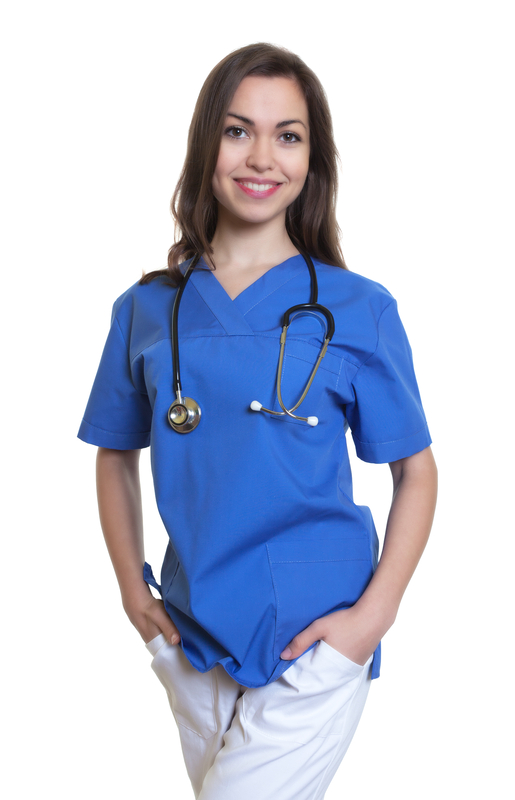 Smiling nurse in blue scrubs, stethoscope.
