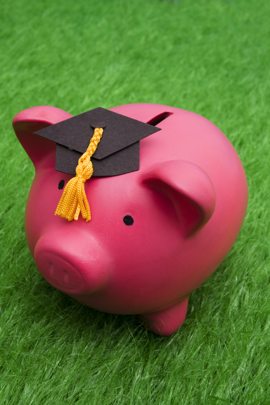 Piggy bank wearing a graduation cap.