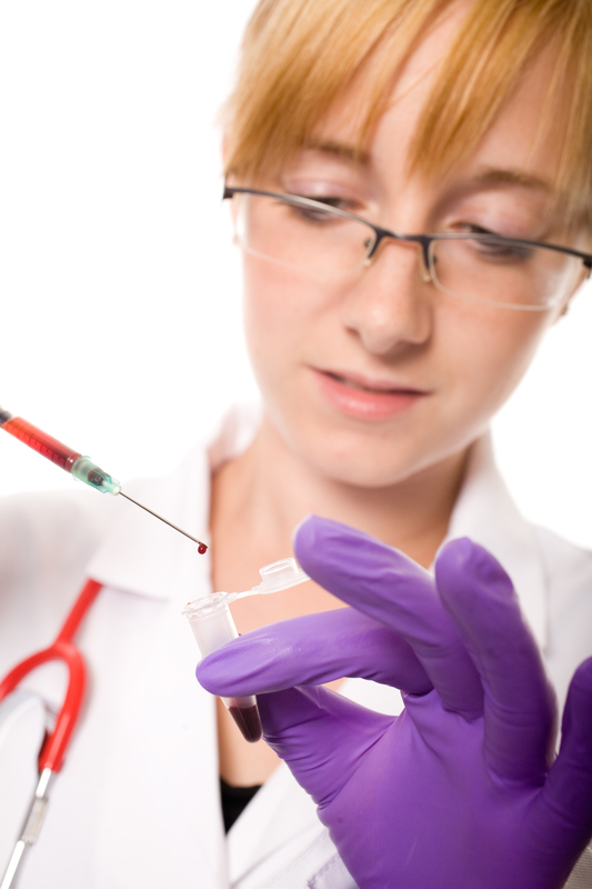 Scientist handling syringe and sample tube.