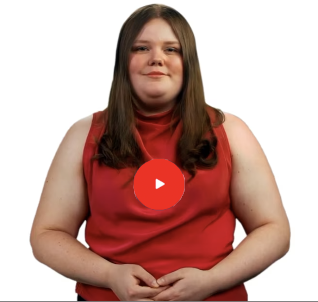Person in red top with play button.