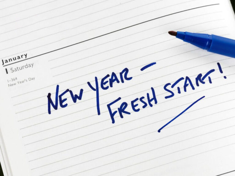 New Year written in blue on planner.